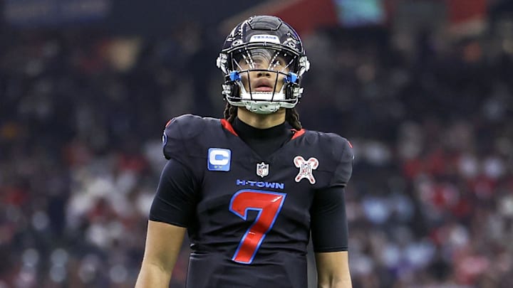 Dec 25, 2024; Houston, Texas, USA;  Houston Texans quarterback C.J. Stroud (7) reacts after a play during the game against the Baltimore Ravens at NRG Stadium. Mandatory Credit: Troy Taormina-Imagn Images