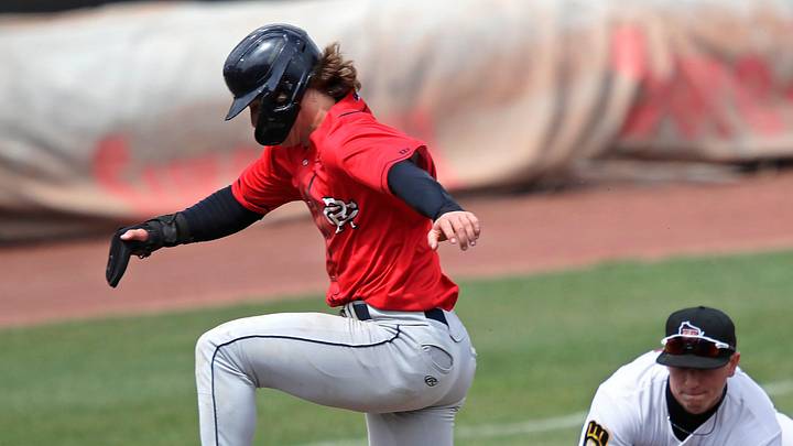 Cedar Rapids Kernels' Luke Keaschall (44) hurdles the ball as Wisconsin Timber Rattlers' Mike Boeve (19) fields it during their baseball game Wednesday, April 17, 2024, at Neuroscience Group Field at Fox Cities Stadium in Grand Chute, Wisconsin. Cedar Rapids Kernels' Luke Keaschall (44) hurdles the ball as Wisconsin Timber Rattlers' Mike Boeve (19) fields it during their baseball game Wednesday, April 17, 2024, at Neuroscience Group Field at Fox Cities Stadium in Grand Chute, Wisconsin.