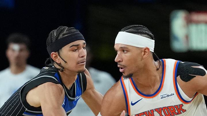 New York Knicks guard Josh Hart works around Orlando Magic guard Anthony Black.