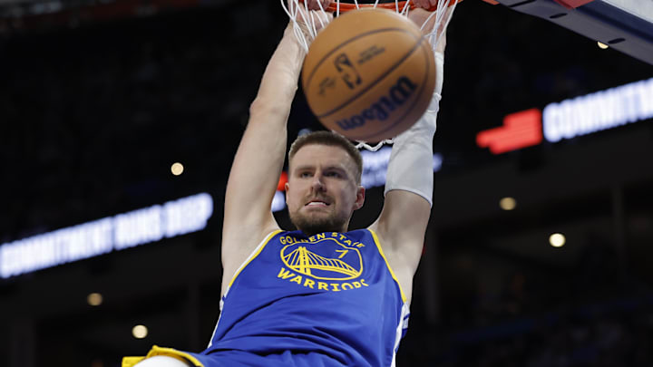 Mar 7, 2026; Oklahoma City, Oklahoma, USA; Golden State Warriors forward/center Kristaps Porziņģis (7) dunks against the Oklahoma City Thunder during the second half at Paycom Center. Mandatory Credit: Alonzo Adams-Imagn Images