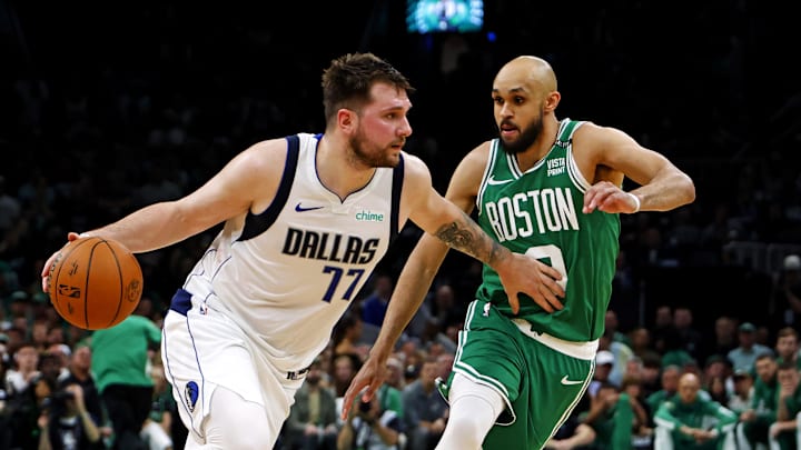 Jun 17, 2024; Boston, Massachusetts, USA; Dallas Mavericks guard Luka Doncic (77) drives to the basket against Boston Celtics guard Derrick White (9) in game five of the 2024 NBA Finals at TD Garden. Mandatory Credit: Peter Casey-Imagn Images Jun 17, 2024; Boston, Massachusetts, USA; Dallas Mavericks guard Luka Doncic (77) drives to the basket against Boston Celtics guard Derrick White (9) in game five of the 2024 NBA Finals at TD Garden. Mandatory Credit: Peter Casey-Imagn Images