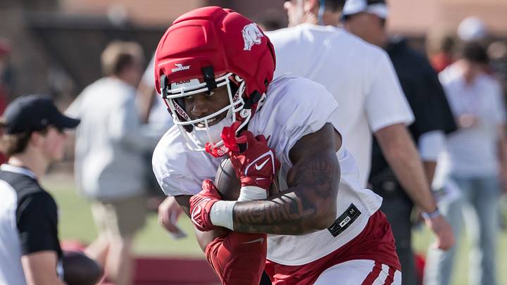 Arkansas Razorbacks wide receiver Chris Marshall (6) wraps up the ball during a passing drill during spring practice at the Arkansas Razorbacks practice facilities. Arkansas Razorbacks wide receiver Chris Marshall (6) wraps up the ball during a passing drill during spring practice at the Arkansas Razorbacks practice facilities.