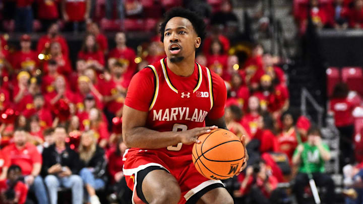 Maryland Terrapins guard David Coit (8) controls the ball