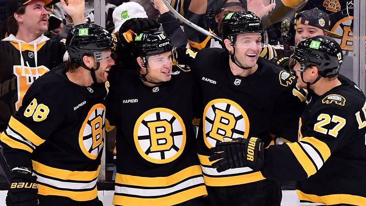 Sep 29, 2026; Boston, Massachusetts, USA;  Boston Bruins forward JJ Peterka celebrates his goal with right wing David Pastrnak (88) defenseman Will Borgen (17) and defenseman Hampus Lindholm (27) during the third period against the New York Rangers at TD Garden. Mandatory Credit: Bob DeChiara-Imagn Images