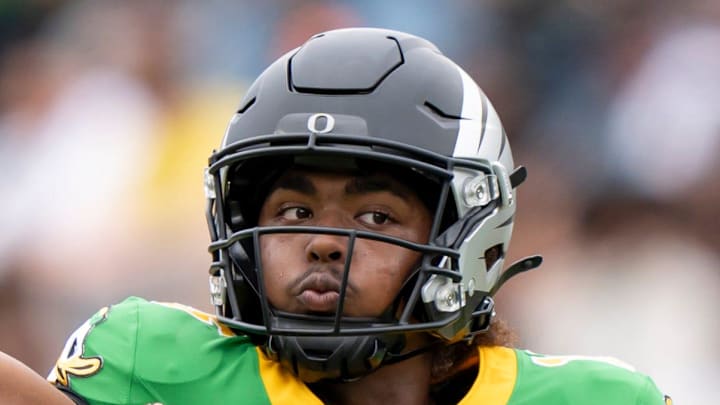Combat Ducks quarterback Akili Smith Jr. throws a pass before the game as the Fighting Ducks face off against Mighty Oregon in the Oregon Ducks spring game on April 26, 2025, at Autzen Stadium in Eugene.