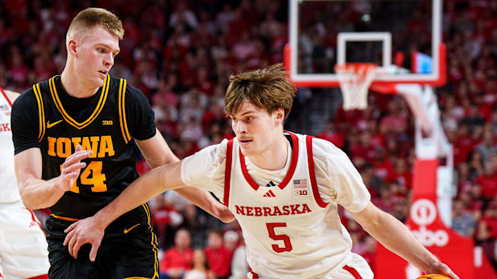 Mar 8, 2026; Lincoln, Nebraska, USA; Nebraska Cornhuskers forward Braden Frager (5) drives against Iowa Hawkeyes guard Bennett Stirtz (14) during the first half at Pinnacle Bank Arena. Mandatory Credit: Dylan Widger-Imagn Images Mar 8, 2026; Lincoln, Nebraska, USA; Nebraska Cornhuskers forward Braden Frager (5) drives against Iowa Hawkeyes guard Bennett Stirtz (14) during the first half at Pinnacle Bank Arena. Mandatory Credit: Dylan Widger-Imagn Images