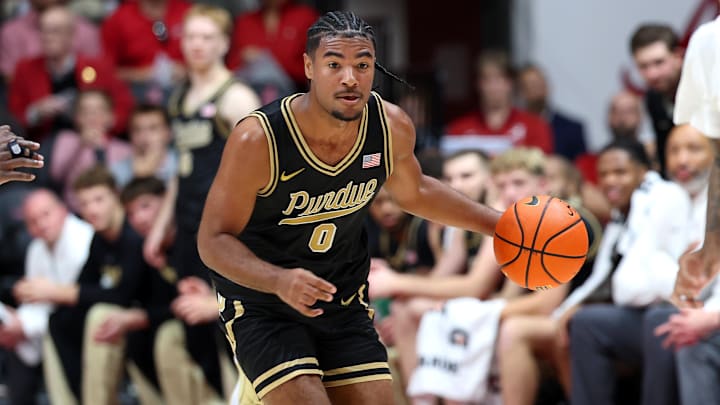 Purdue Boilermakers guard C.J. Cox (0) dribbles the basketball Purdue Boilermakers guard C.J. Cox (0) dribbles the basketball