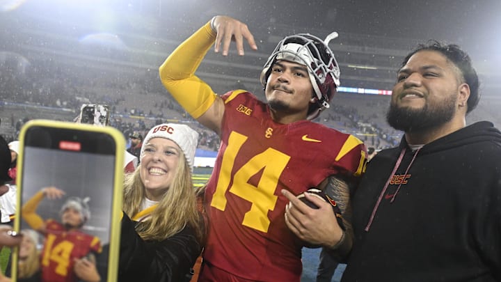 Nov 23, 2024; Pasadena, California, USA;  USC Trojans quarterback Jayden Maiava (14) celebrates the win over UCLA at Rose Bowl. Mandatory Credit: Robert Hanashiro-Imagn Images
