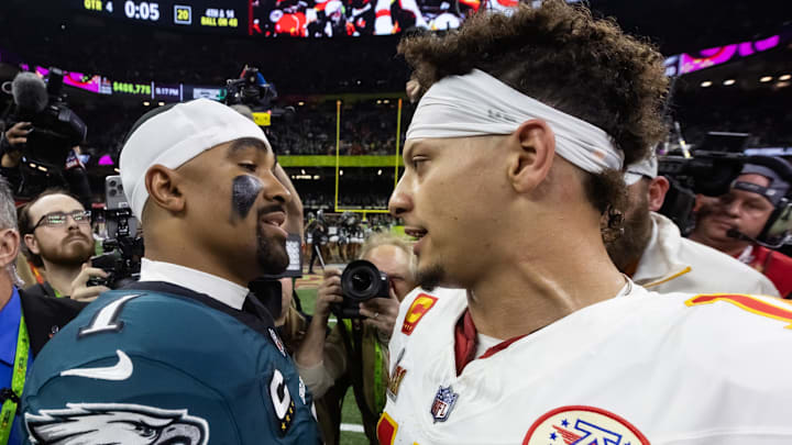Feb 9, 2025; New Orleans, LA, USA; Philadelphia Eagles quarterback Jalen Hurts (1) greets Kansas City Chiefs quarterback Patrick Mahomes (15) following Super Bowl LIX at Ceasars Superdome. Mandatory Credit: Mark J. Rebilas-Imagn Images
