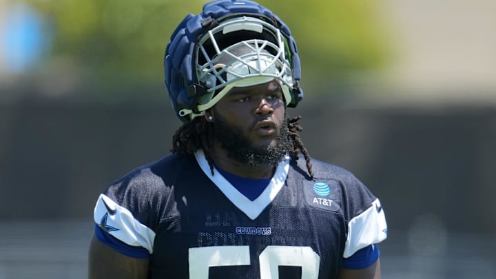 Jul 29, 2023; Oxnard, CA, USA; Dallas Cowboys defensive tackle Mazi Smith (58) wears a Guardian helmet cap during training camp at the River Ridge Fields. Mandatory Credit: Kirby Lee-Imagn Images