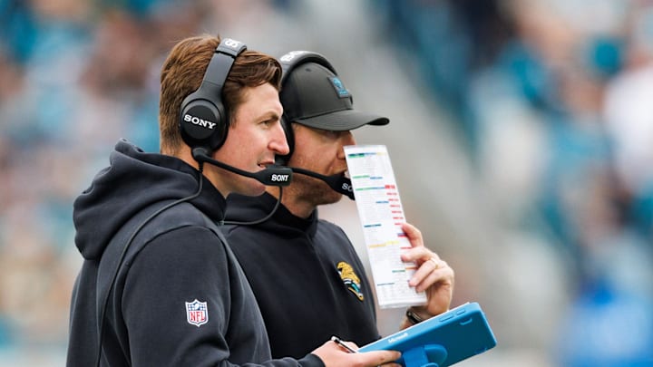 Jan 4, 2026; Jacksonville, Florida, USA; Jacksonville Jaguars offensive coordinator Grant Udinski and head coach Liam Coen during the second quarter against the Tennessee Titans at EverBank Stadium. Mandatory Credit: Morgan Tencza-Imagn Images
