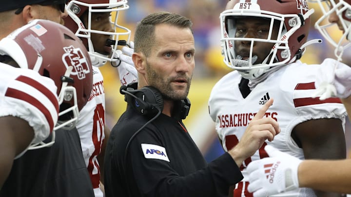 Sep 4, 2021; Pittsburgh, Pennsylvania, USA; Massachusetts Minutemen assistant head coach
Luke Paschall (middle) speaks to his team in the huddle
against the Pittsburgh Panthers during the second quarter at Heinz Field. Mandatory Credit: Charles LeClaire-Imagn Images Sep 4, 2021; Pittsburgh, Pennsylvania, USA; Massachusetts Minutemen assistant head coach
Luke Paschall (middle) speaks to his team in the huddle
against the Pittsburgh Panthers during the second quarter at Heinz Field. Mandatory Credit: Charles LeClaire-Imagn Images