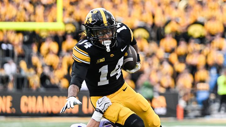Sep 19, 2026; Iowa City, Iowa, USA; Iowa Hawkeyes wide receiver Tony Diaz (14) tries to escape from UNI Panthers safety Calvin Jaworski (21) during the second quarter at Kinnick Stadium. Mandatory Credit: Jeffrey Becker-Imagn Images Sep 19, 2026; Iowa City, Iowa, USA; Iowa Hawkeyes wide receiver Tony Diaz (14) tries to escape from UNI Panthers safety Calvin Jaworski (21) during the second quarter at Kinnick Stadium. Mandatory Credit: Jeffrey Becker-Imagn Images