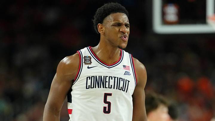 Apr 4, 2026; Indianapolis, IN, USA; UConn Huskies forward Tarris Reed Jr. (5) reacts after a play against the Illinois Fighting Illini during the first half of a semifinal of the Final Four of the men's 2026 NCAA Tournament at Lucas Oil Stadium. Mandatory Credit: Bob Donnan-Imagn Images