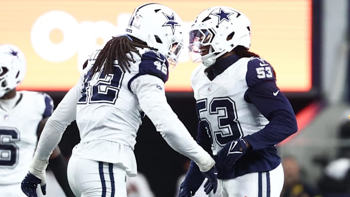 Dallas Cowboys outside linebacker Jadeveon Clowney and defensive end James Houston celebrate after a sack.