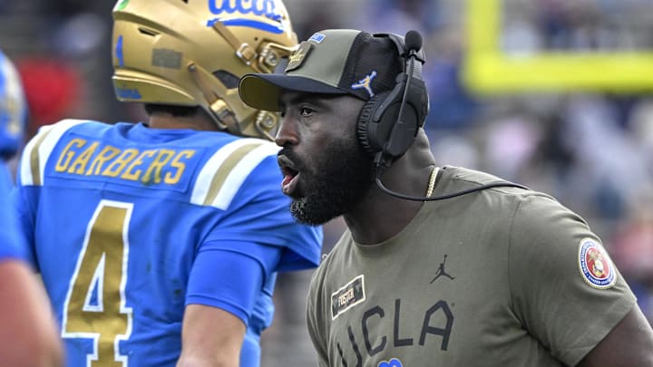 Nov 30, 2024; Pasadena, California, USA; UCLA Bruins head coach DeShaun Foster greets his players after a Bruins touchdown against the Fresno State Bulldogs in the third quarter at Rose Bowl. Mandatory Credit: Robert Hanashiro-Imagn Images
