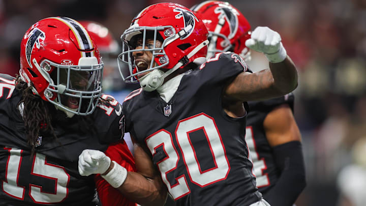 Atlanta Falcons linebacker Matthew Judon and cornerback Dee Alford celebrate after a turnover on downs.