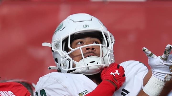Cal Poly Mustangs wide receiver Michael Briscoe battles for a pass