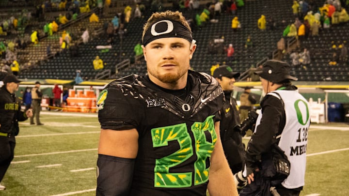 Oregon Ducks Dan Lanning Dante Moore Dakorien Moore Big Ten Wisconsin Badgers College Football Playoff injury bryce boettcher Oregon Ducks Dan Lanning Dante Moore Dakorien Moore Big Ten Wisconsin Badgers College Football Playoff injury bryce boettcher