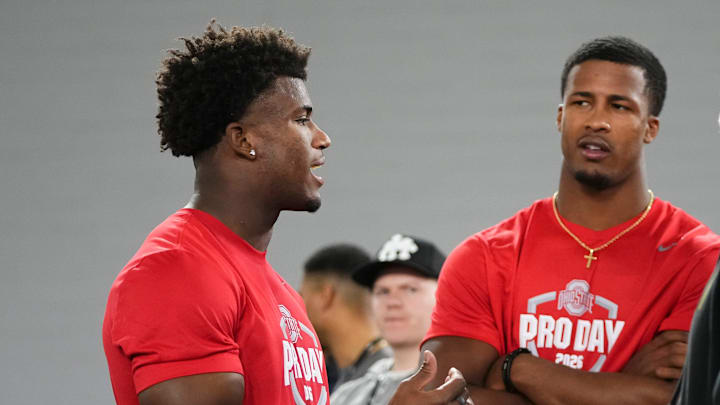 Ohio State Buckeyes defensive back Caleb Downs and linebacker Sonny Styles talk to Washington Commanders head coach Dan Quinn during Pro Day for NFL scouts at the Woody Hayes Athletics Center on March 25, 2026.