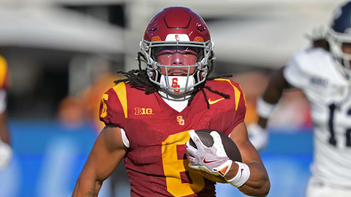 Sep 6, 2025; Los Angeles, California, USA;  USC Trojans wide receiver Makai Lemon (6) runs down field for a touchdown on a pass play during the first half against the Georgia Southern Eagles at the Los Angeles Memorial Coliseum. Mandatory Credit: Jayne Kamin-Oncea-Imagn Images