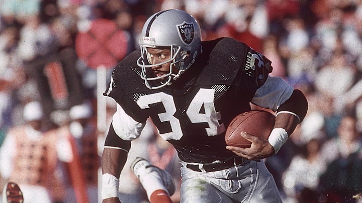 Dec 16, 1990; Los Angeles, CA, USA; FILE PHOTO; Los Angeles Raiders running back Bo Jackson (34) carries the ball past Cincinnati Bengals linebacker James Francis (50) at Los Angeles Memorial Coliseum. Mandatory Credit: Peter Brouillet-USA TODAY NETWORK