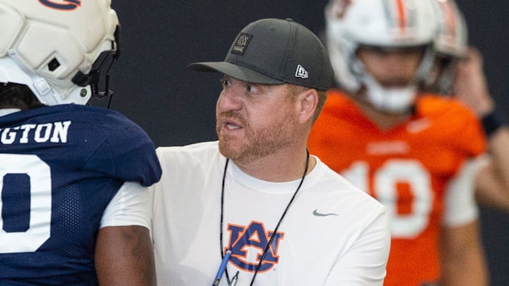 Auburn Tigers head coach Alex Golesh talks with Auburn Tigers running back Bryson Washington (30) during practice at Woltosz Football Performance Center in Auburn, Ala. on Thursday, April 16, 2026.