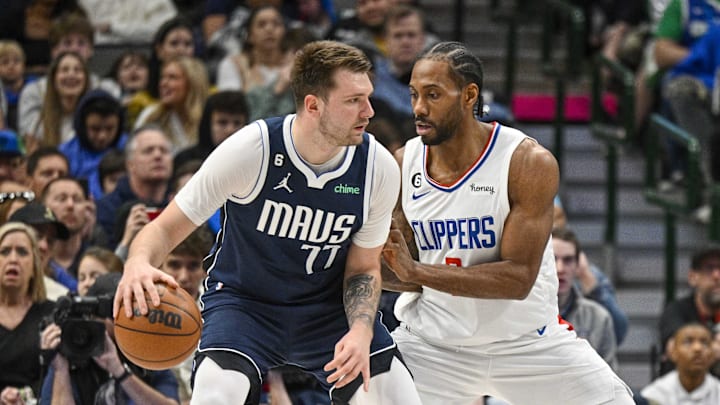 Jan 22, 2023; Dallas, Texas, USA; Dallas Mavericks guard Luka Doncic (77) and LA Clippers forward Kawhi Leonard (2) in action during the game between the Dallas Mavericks and the LA Clippers at the American Airlines Center. Mandatory Credit: Jerome Miron-Imagn Images