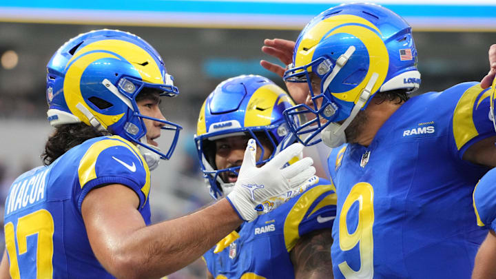 Dec 8, 2024; Inglewood, California, USA; Los Angeles Rams wide receiver Puka Nacua (17) celebrates with quarterback Matthew Stafford (9) and running back Kyren Williams (23) after scoring on a 4-yard touchdown run in the second quarter against the Buffalo Bills at SoFi Stadium. Mandatory Credit: Kirby Lee-Imagn Images