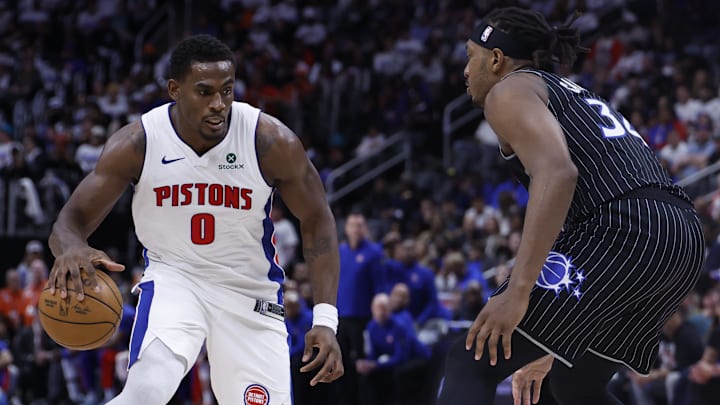 Apr 19, 2026; Detroit, Michigan, USA; Detroit Pistons center Jalen Duren (0) dribbles defended by Orlando Magic center Wendell Carter Jr. (34) in the second half during the 2026 NBA Playoffs at Little Caesars Arena.