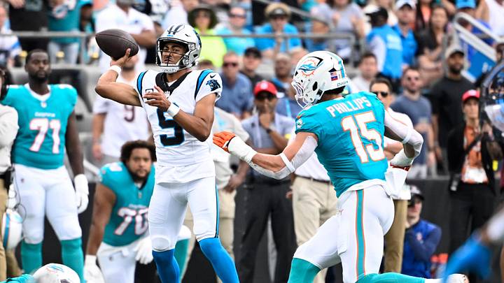 Carolina Panthers quarterback Bryce Young (9) passes the ball as Miami Dolphins linebacker Jaelan Phillips (15) pressures 