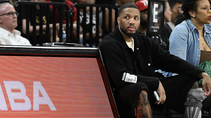 May 30, 2025; Las Vegas, Nevada, USA; NBA player Damian Lillard sits courtside during the Las Vegas Aces and Los Angeles Sparks game at Michelob Ultra Arena. Mandatory Credit: Candice Ward-Imagn Images May 30, 2025; Las Vegas, Nevada, USA; NBA player Damian Lillard sits courtside during the Las Vegas Aces and Los Angeles Sparks game at Michelob Ultra Arena. Mandatory Credit: Candice Ward-Imagn Images