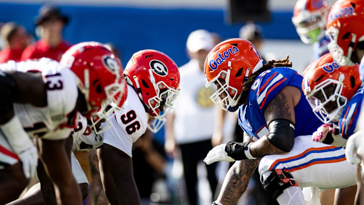 Florida Gators offensive lineman Kingsley Eguakun (65) and Georgia Bulldogs defensive lineman Zion Logue (96) faceoff before the snap during the first half at Everbank Stadium in Jacksonville, FL on Saturday, October 28, 2023. [Matt Pendleton/Gainesville Sun]