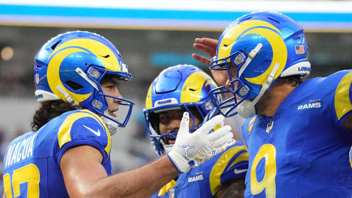 Dec 8, 2024; Inglewood, California, USA; Los Angeles Rams wide receiver Puka Nacua (17) celebrates with quarterback Matthew Stafford (9) and running back Kyren Williams (23) after scoring a touchdown run in the second quarter against the Buffalo Bills at SoFi Stadium. Mandatory Credit: Kirby Lee-Imagn Images Dec 8, 2024; Inglewood, California, USA; Los Angeles Rams wide receiver Puka Nacua (17) celebrates with quarterback Matthew Stafford (9) and running back Kyren Williams (23) after scoring a touchdown run in the second quarter against the Buffalo Bills at SoFi Stadium. Mandatory Credit: Kirby Lee-Imagn Images