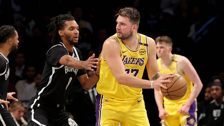 Mar 10, 2025; Brooklyn, New York, USA; Los Angeles Lakers guard Luka Doncic (77) looks to pass the ball against Brooklyn Nets forward Ziaire Williams (8) during the third quarter at Barclays Center. Mandatory Credit: Brad Penner-Imagn Images Mar 10, 2025; Brooklyn, New York, USA; Los Angeles Lakers guard Luka Doncic (77) looks to pass the ball against Brooklyn Nets forward Ziaire Williams (8) during the third quarter at Barclays Center. Mandatory Credit: Brad Penner-Imagn Images
