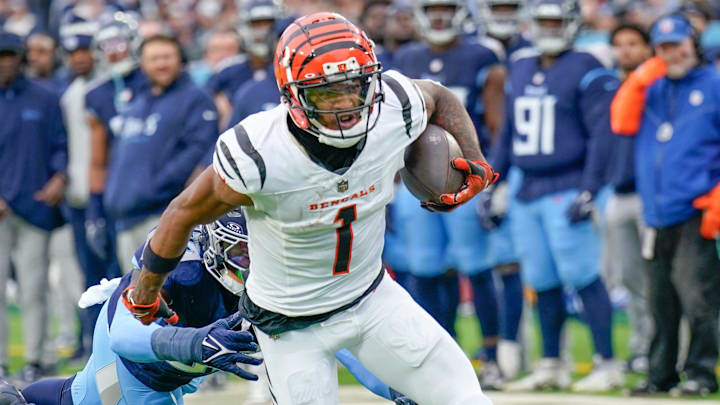 Cincinnati Bengals wide receiver Ja'Marr Chase (1) catches a pass over Tennessee Titans linebacker James Williams (52) during the second quarter at Nissan Stadium in Nashville, Tenn., Sunday, Dec. 15, 2024.