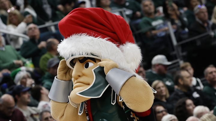 Michigan State mascot "Sparty" wears a Santa hat during a men's basketball game against the Oakland Golden Grizzlies at Little Caesars Arena on Saturday, Dec. 20, 2025.