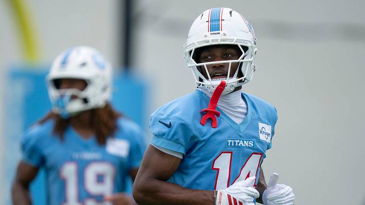 Tennessee Titans wide receivers Tyren Montgomery (19) and Carnell Tate (14) head back to the huddle during organized team activities at Vanderbilt Health Football Center Friday, May 29, 2026.