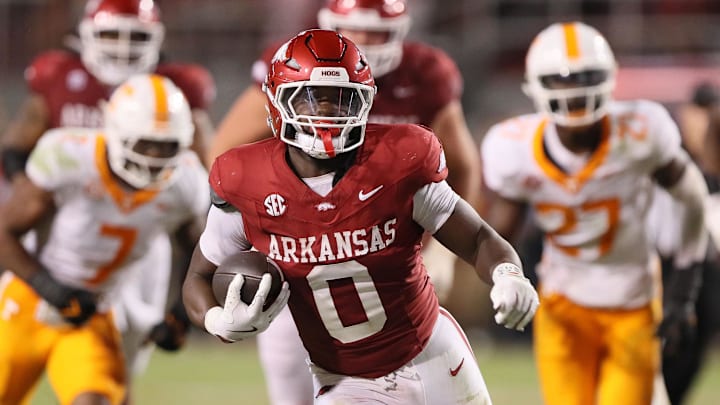 Arkansas running back Braylen Russell pulls away from No. 4 Tennessee in the fourth quarter at Donald W. Reynolds Razorback Stadium. Arkansas won 19-14. 