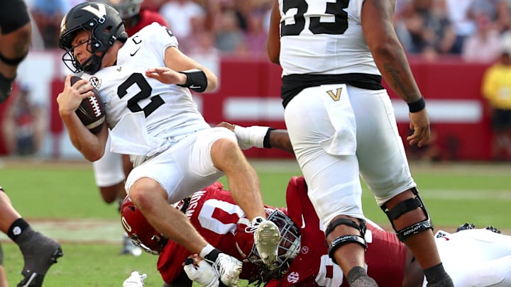 Oct 4, 2025; Tuscaloosa, Alabama, USA; Vanderbilt Commodores quarterback Diego Pavia (2) is tackled during the second half against the Alabama Crimson Tide at Saban Field at Bryant-Denny Stadium. Mandatory Credit: David Leong-Imagn Images