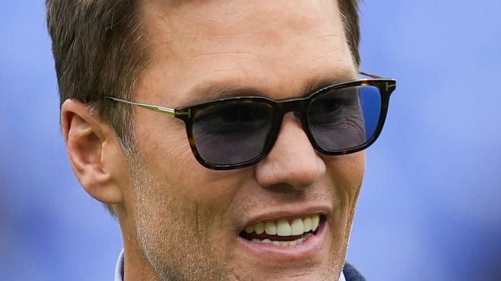 Oct 12, 2025; Baltimore, Maryland, USA; Fox Sports announcer Tom Brady looks on before the game between the Baltimore Ravens and the Los Angeles Rams at M&T Bank Stadium. Mandatory Credit: Mitch Stringer-Imagn Images Oct 12, 2025; Baltimore, Maryland, USA; Fox Sports announcer Tom Brady looks on before the game between the Baltimore Ravens and the Los Angeles Rams at M&T Bank Stadium. Mandatory Credit: Mitch Stringer-Imagn Images