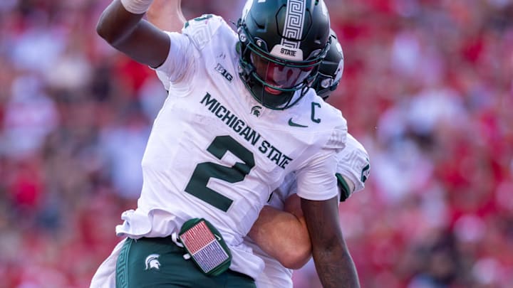Oct 4, 2025; Lincoln, Nebraska, USA; Michigan State Spartans quarterback Aidan Chiles (2) celebrates after scoring a rushing touchdown during the game against Nebraska at Memorial Stadium. Mandatory Credit: Kylie Graham-Imagn Images