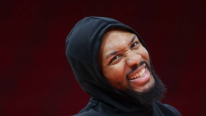 Damian Lillard smiles on the court before the game against the Houston Rockets. Damian Lillard smiles on the court before the game against the Houston Rockets.