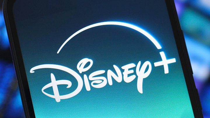 In this photo illustration, the Disney Plus logo is seen...