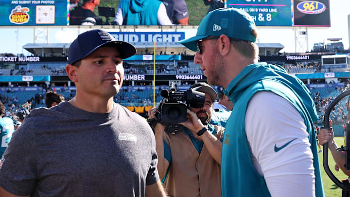 Oct 12, 2025; Jacksonville, Florida, USA; Jacksonville Jaguars head coach Liam Coen and Seattle Seahawks head coach Mike MacDonald react after the game at EverBank Stadium. Mandatory Credit: Morgan Tencza-Imagn Images