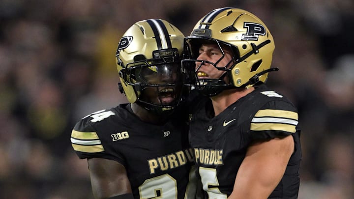 Purdue Boilermakers defensive back An'Darius Coffey (24) celebrates a sack with linebacker Charles Correa (5) Purdue Boilermakers defensive back An'Darius Coffey (24) celebrates a sack with linebacker Charles Correa (5)