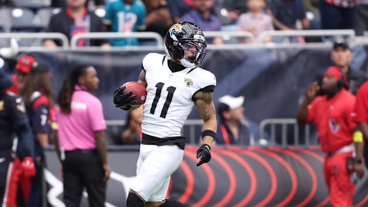 Nov 9, 2025; Houston, Texas, USA; Jacksonville Jaguars wide receiver Parker Washington (11) returns a punt for a touchdown against the Houston Texans during the first half at NRG Stadium. Mandatory Credit: Troy Taormina-Imagn Images