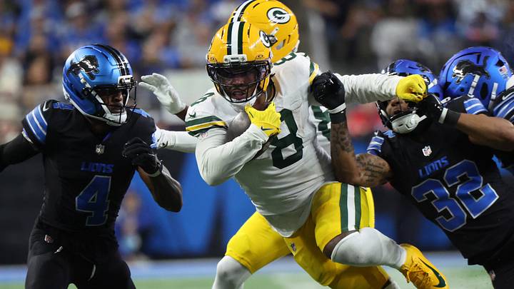Green Bay Packers running back Josh Jacobs (8) runs the ball for a first down against the Detroit Lions at Ford Field. 