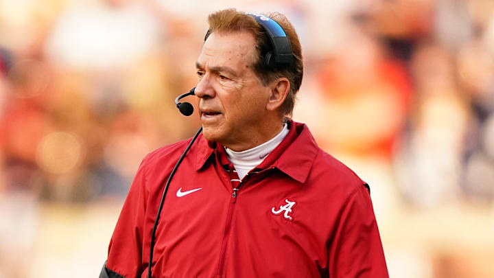 Nov 25, 2023; Auburn, Alabama, USA; Alabama Crimson Tide head coach Nick Saban walks out onto the field during a timeout against the Auburn Tigers during the second quarter at Jordan-Hare Stadium. Mandatory Credit: John David Mercer-Imagn Images