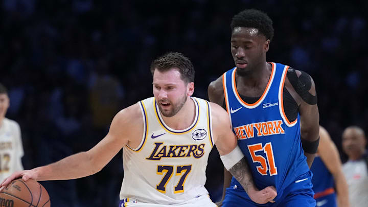 Mar 8, 2026; Los Angeles, California, USA; Los Angeles Lakers guard Luka Doncic (77) dribbles against New York Knicks forward Mohamed Diawara (51) in the first half at Crypto.com Arena. Mandatory Credit: Kirby Lee-Imagn Images Mar 8, 2026; Los Angeles, California, USA; Los Angeles Lakers guard Luka Doncic (77) dribbles against New York Knicks forward Mohamed Diawara (51) in the first half at Crypto.com Arena. Mandatory Credit: Kirby Lee-Imagn Images